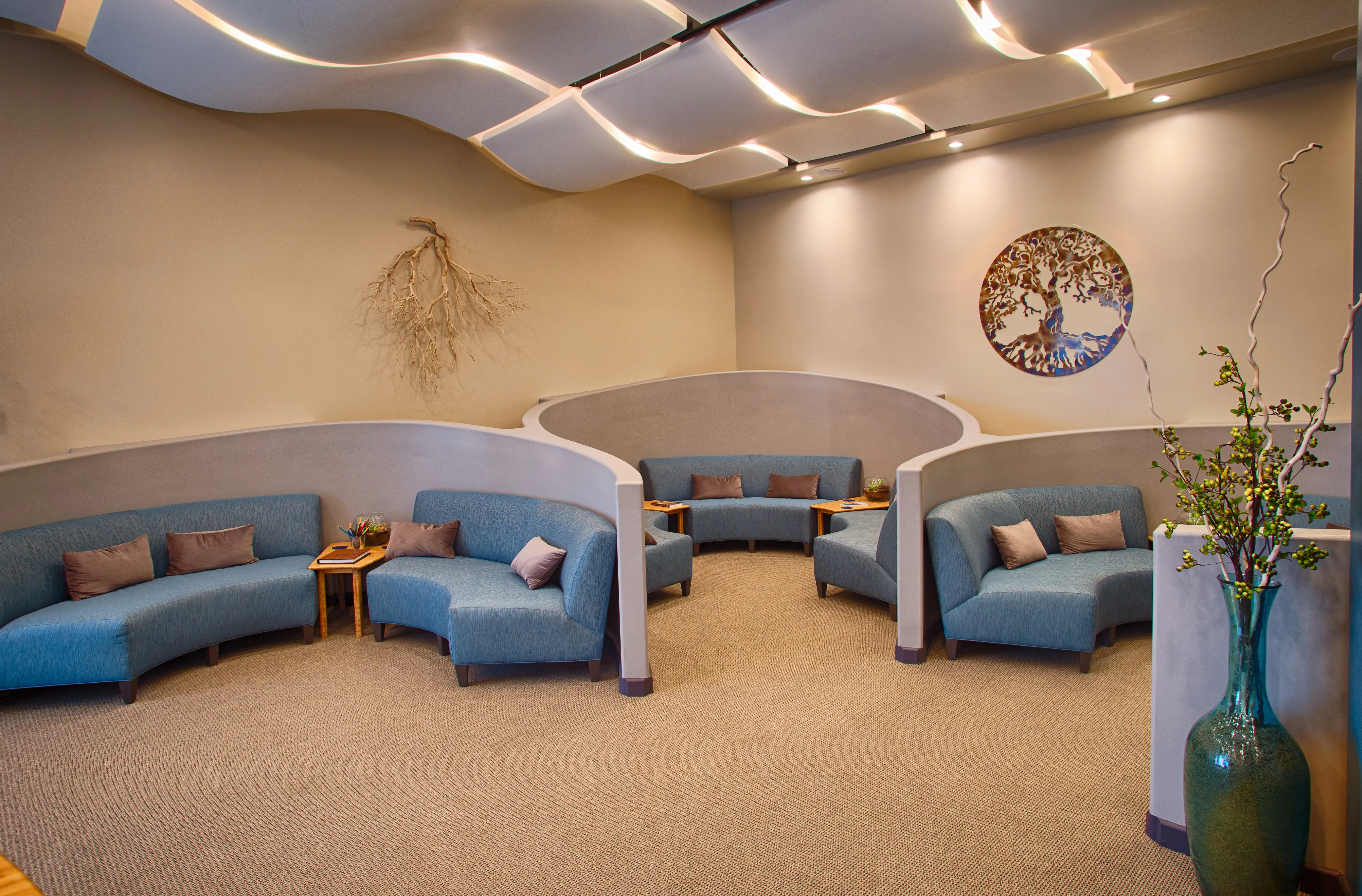 The Just Float center lobby — curved blue lounges, sculpted ceiling, signature interior architecture